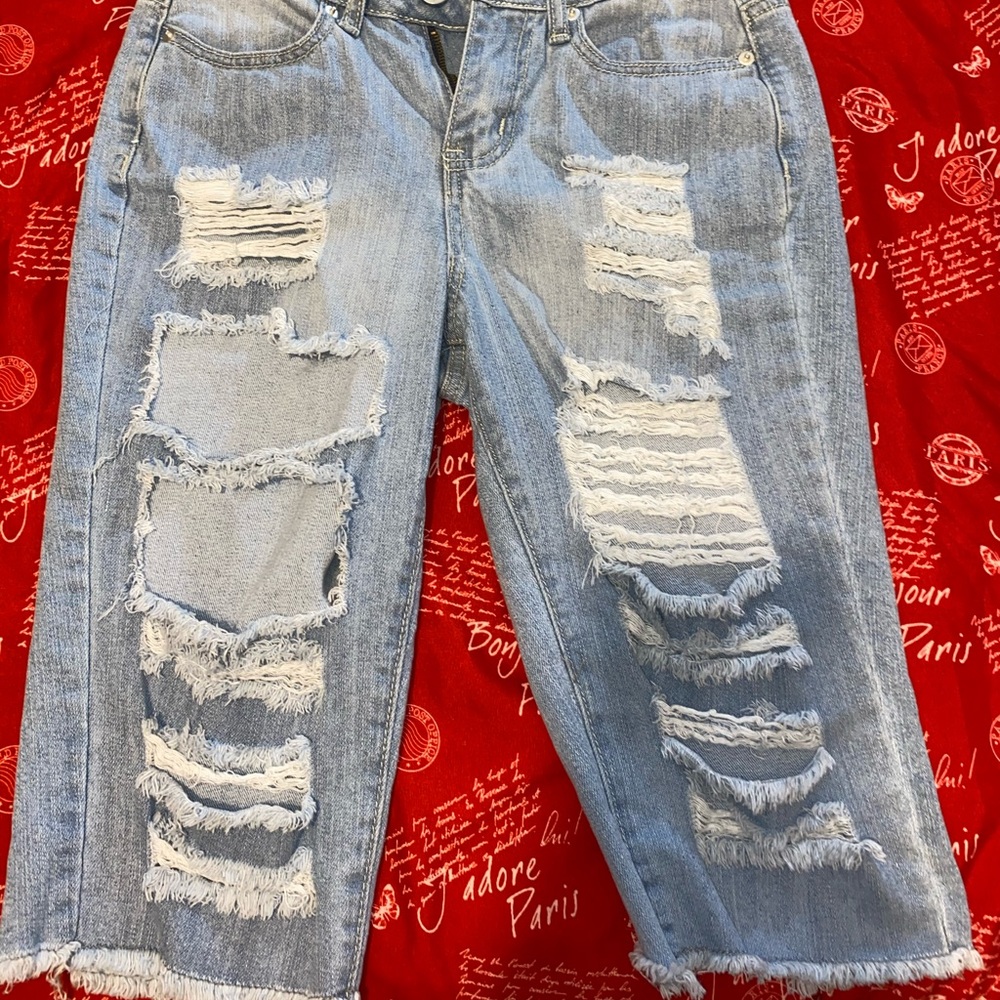 distressed long jean shorts.